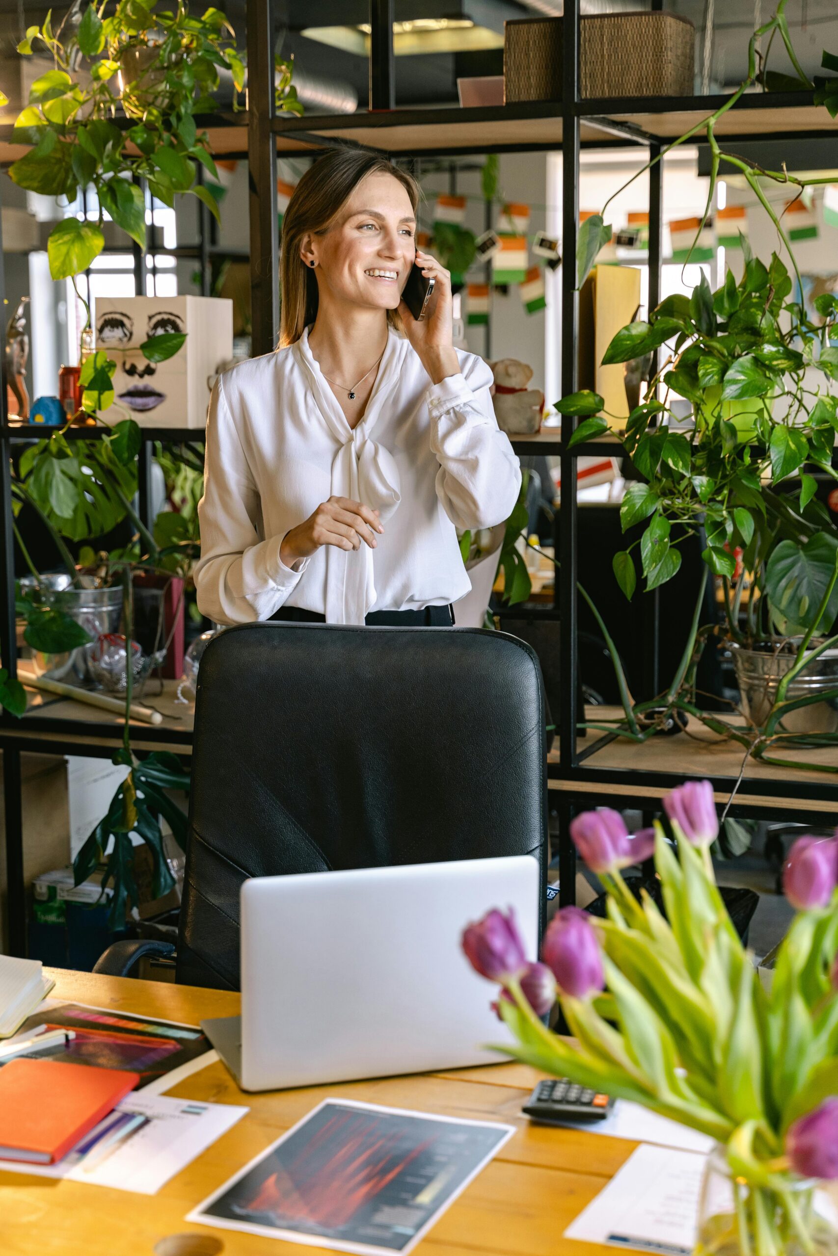 A woman talking on the phone in an office