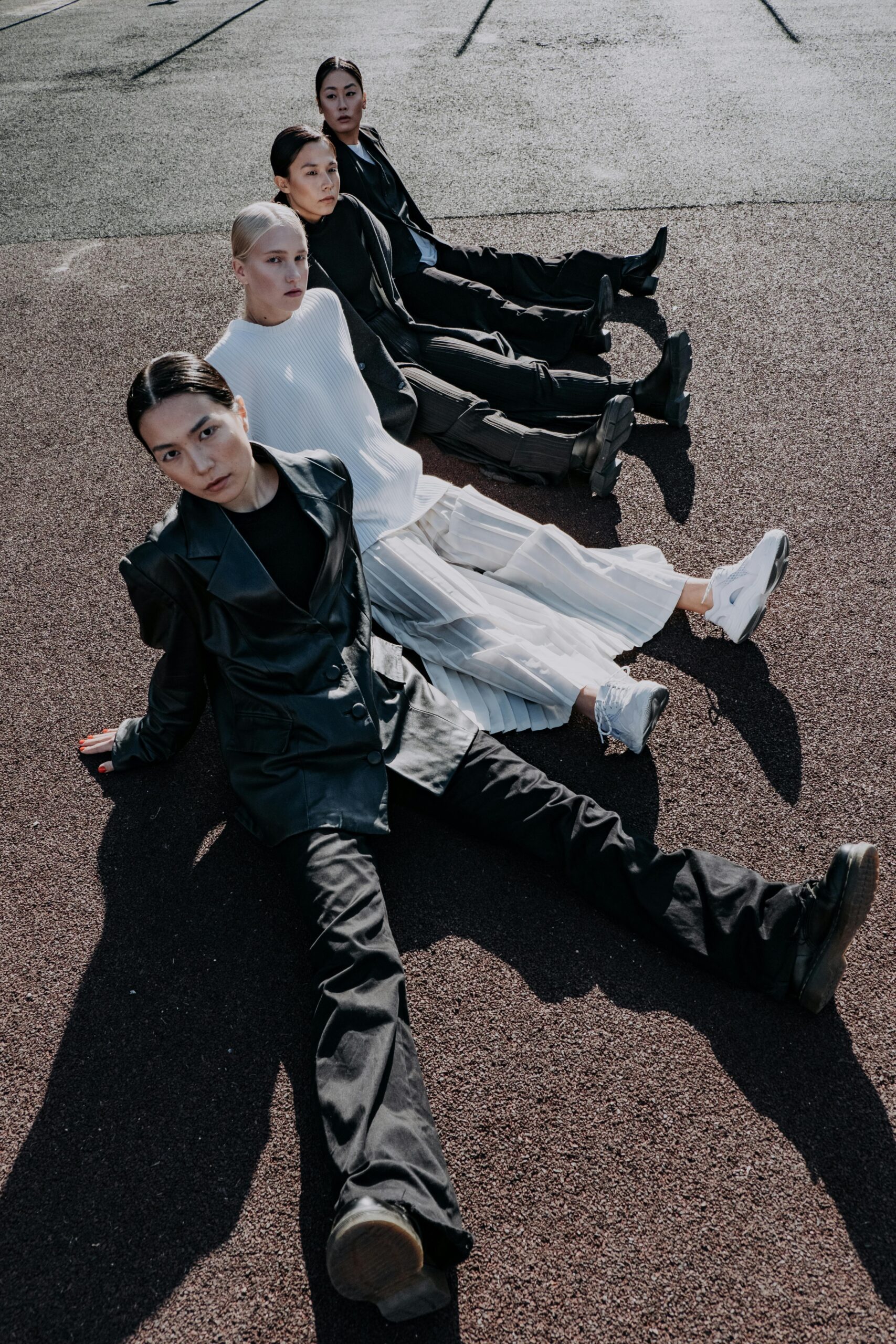 4 women sitting in a row